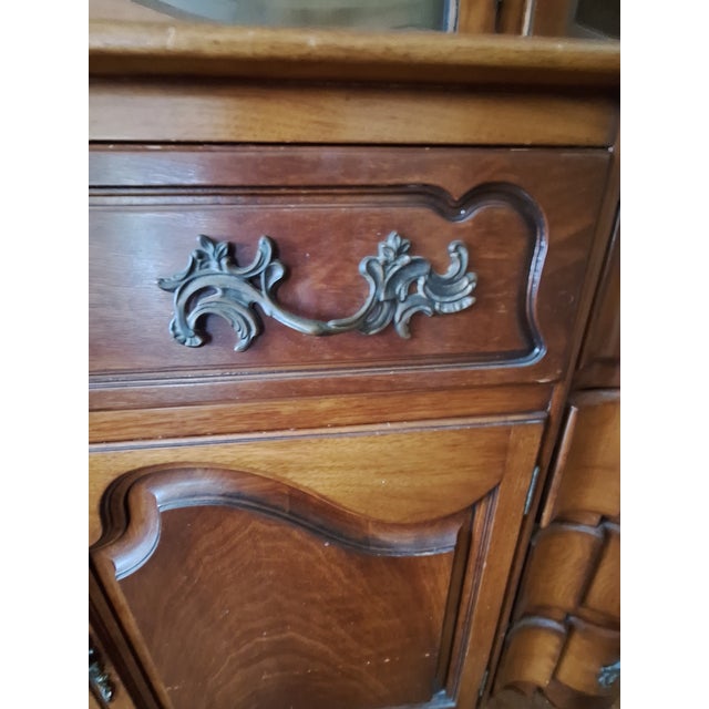 This is acKarges Mid-Century Breakfront with carved wood and 3 original keys. I love the secretary's pull-out drawer;...
