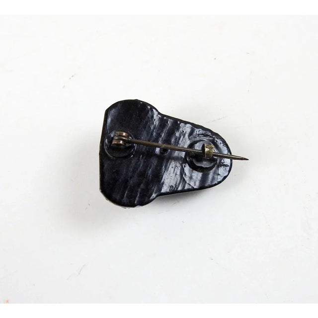 Small vintage circa 1950's black lacquer and rhinestone acorn pin. Unsigned, pin and hook finding, good condition.
