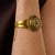 This elegant Victorian bangle is a beautifully refined jewel from the 1900’s, featuring 3 square cut emeralds arranged...