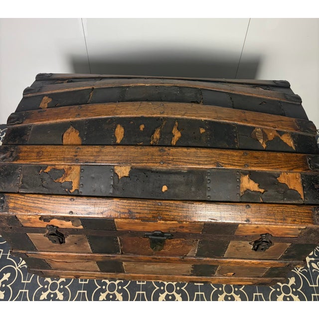 Antique dome-top trunk (also commonly referred to as a camelback, barrel-top, or humpback trunk) dating from the late...