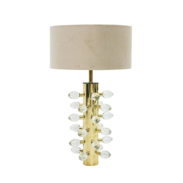 Contemporary italian pair of table lamps. Cylindrical structure made of brass with clear murano glass pieces. dimensions...