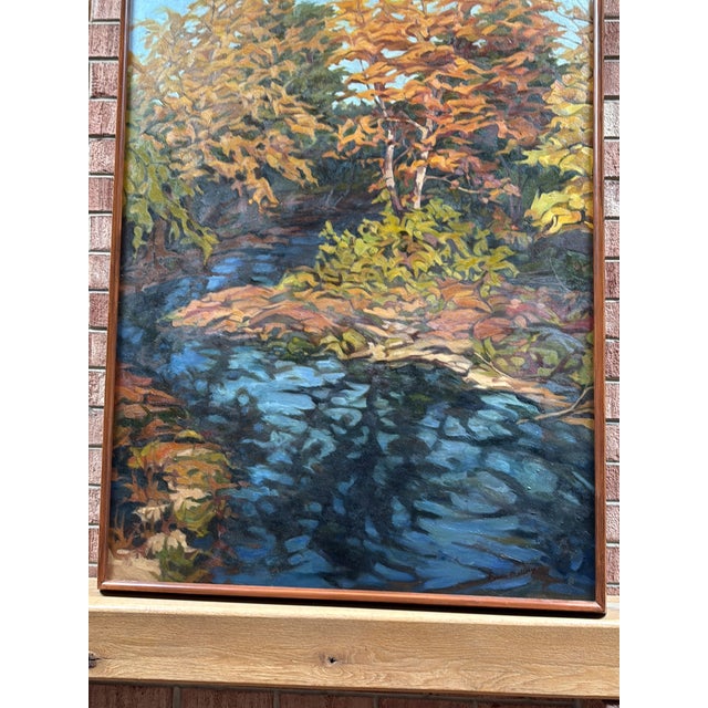A bold and luminous American Impressionist autumn landscape — golden and amber foliage blazing against a cerulean sky, a...