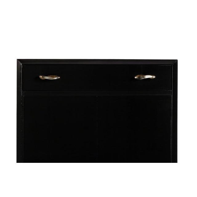 A Black Lacquer cabinet with drawer and five shelves, manufactured in the parish of Bonfim, Porto at «Armazéns Nascimento»...