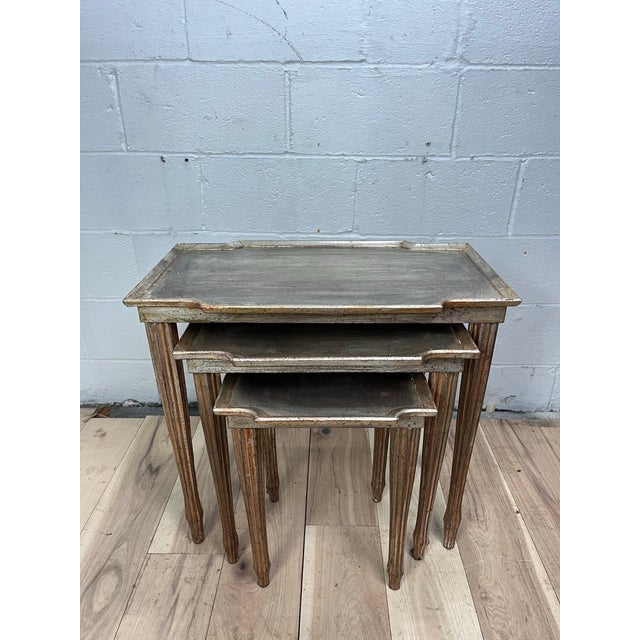 A sophisticated set of three vintage Italian Florentine nesting tables dating to the 1960s. Crafted from wood, each...