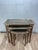 A sophisticated set of three vintage Italian Florentine nesting tables dating to the 1960s. Crafted from wood, each...