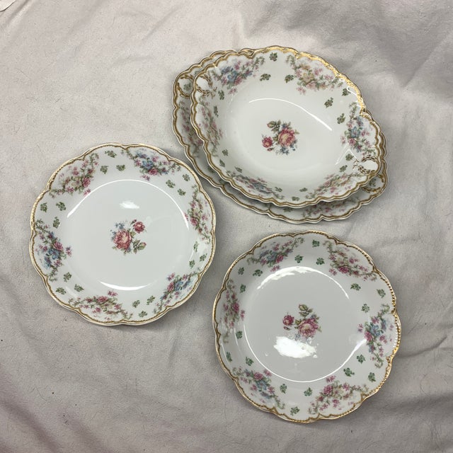This set features antique Haviland Limoges porcelain bowls and a platter in the classic Schleiger 72 floral pattern with...