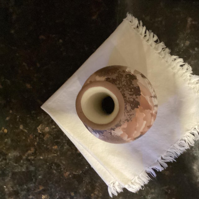 Unique of American and painted vase was gifted. Doing some little research I learned that each artist who signed the piece...