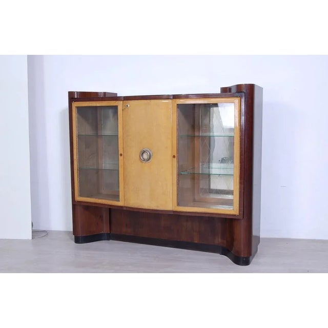 Beautiful mobile bar, sideboard, design and production of the 1930s in Art Decò style. Elegant design with moved and...