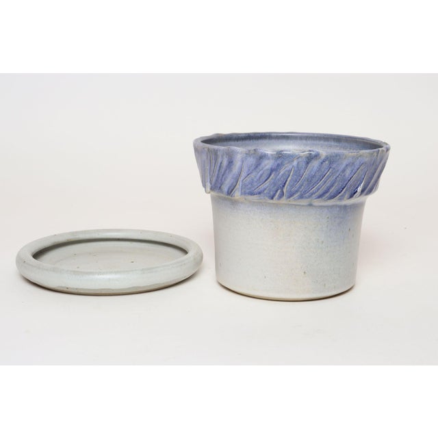 Studio ceramic planter with drainage hole and saucer/plate by ceramicist, Deanna Nichols (b. 1942-2017, Missouri). Holding...