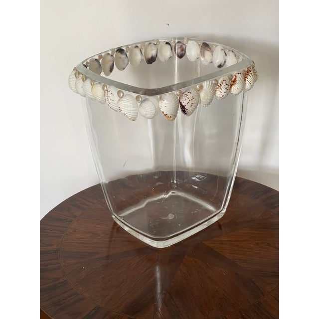 Nice lucite wastebasket decorated with two rows of sea shellx