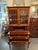 This is a vintage mahogany with inlay tambour Secretary. It has two large drawers, and six small drawers for storage. The...