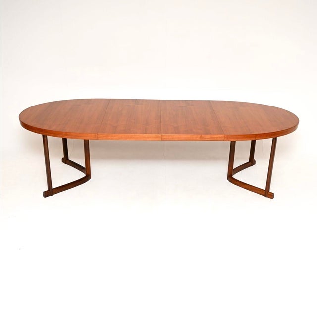 A stunning Danish vintage teak dining table by Johannes Andersen, dating from the 1960’s. It is of outstanding quality,...