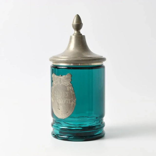 Mid-Century French turquoise glass container with pewter lid and plate. Made in France by L'Etain a La Rose. This piece...