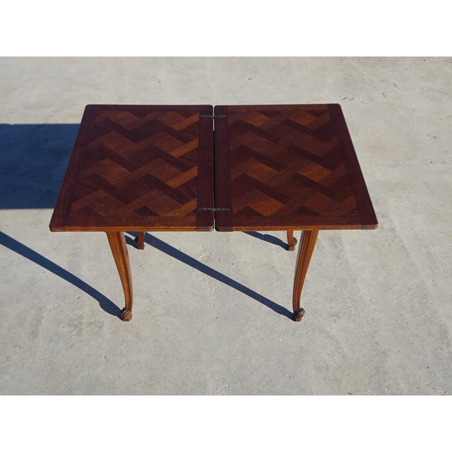 Modular folding table, the tabletop pivots and unfolds to double its surface area. Made in France using traditional...