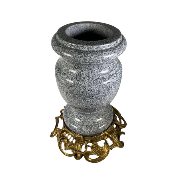 A striking French decorative urn crafted from gray and white speckled granite and mounted on an elegant bronze dore Louis...