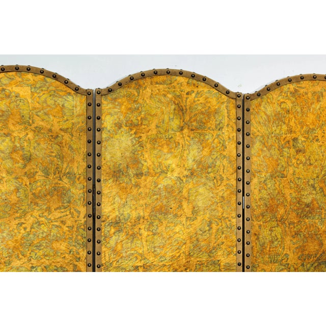 This four-panel screen offers a bold, luminous presence with its sculptural silhouette and richly textured surface....