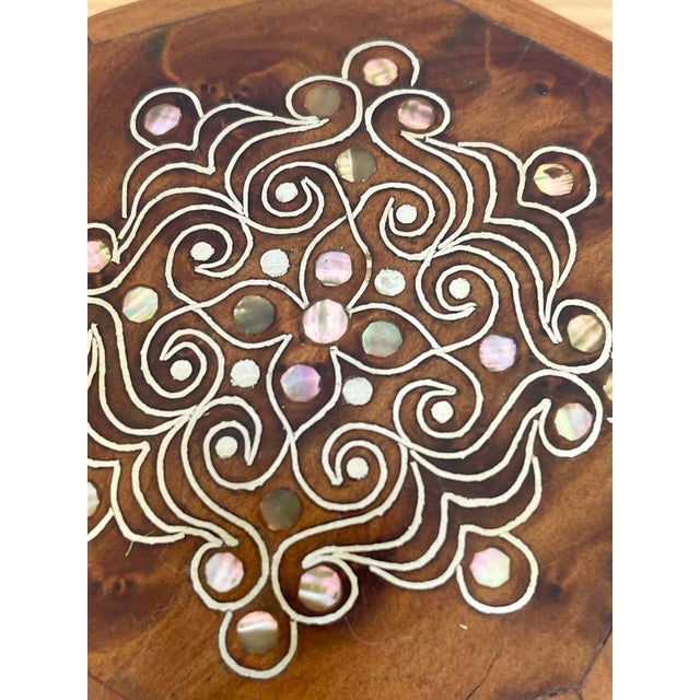 Antique beautiful small octagonal olive root wood box with intricate inlay of silver and mother of pearl.