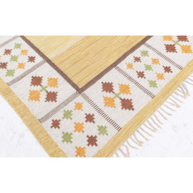 Vintage Swedish Flat Woven by Birgitta Soderkvist Size: 5'6" × 8'1" (167 × 246 cm) This charming flat-woven Swedish rug by...