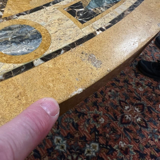 Vintage specimen marble center table with concentric circles with rounded triangular designs in shades of tan/yellow, with...