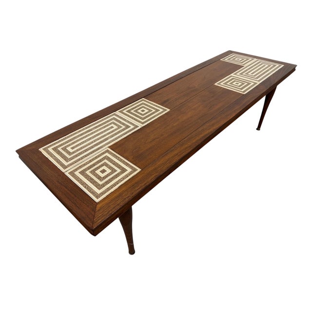 Striking Mid-Century Modern walnut and tile-top coffee table, featuring a distinctive geometric design that gives this...