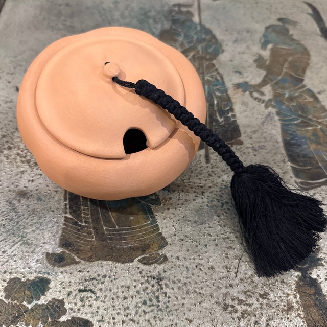 Elsa Peretti for Tiffany & Co. terracotta bowl. Topped with a black silk tassel cord. Made in Italy. From a Palm Beach Estate