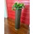 This vintage 1960s floor planter features a tall cylindrical woven form in a rich dark finish, accented with a brass rim....