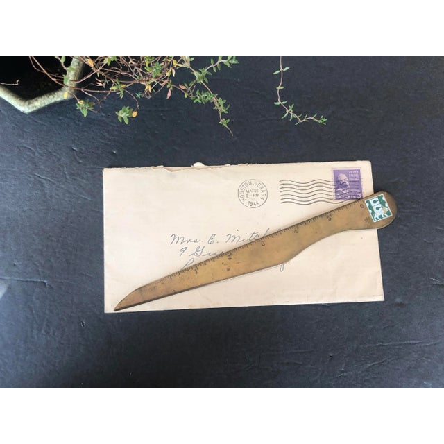 A handy dual home or office desk tool, this vintage brass letter opener doubles as a ruler. The brass letter opener...