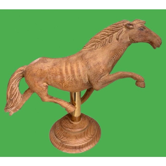 Vintage hand carved wood horse. A sculpture beautifully detailed that captures the essence of equestrian artistry. A solid...
