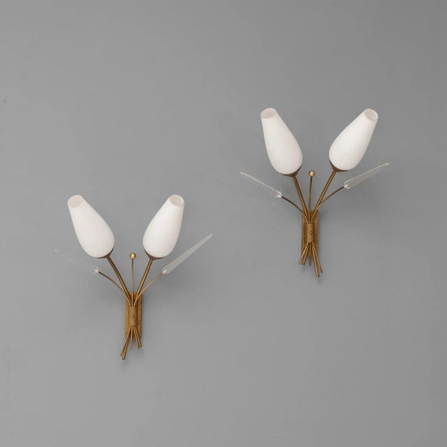 Pair of Mid-Century twin neck wall lights. Brass stems with opaline fluted shades, with extra brass stems and acrylic...