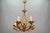 - Italian Hollywood Regency style gilt metal five-light chandelier, circa the 1970s - A beautiful Italian gilt...