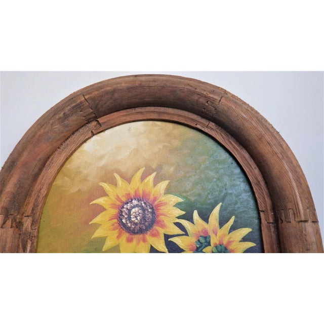 Joyful sunflowers in a red ceramic vase are painted on a linen canvas in a style reminiscent of the 1930s and signed by...