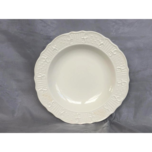 Made by Vogue Pottery in the 1940s, this Washington Colonial soup bowl has a lovely embossed pattern around the rim. The...