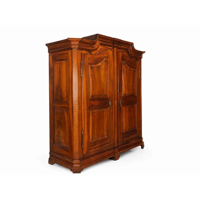Germany, circa 1780 a fine and elegant louis xvi armoire, masterfully crafted in solid walnut and embellished with...