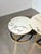 Elegant set of two round nesting coffee tables featuring white marble style tops with distinctive grey veining, combined...