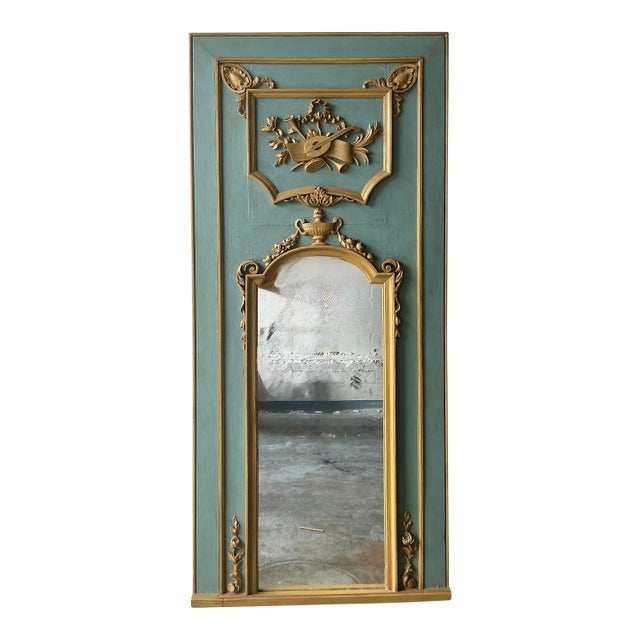 This exquisite vintage Trumeau mirror embodies the opulence and grandeur of the Hollywood Regency style. Featuring a...
