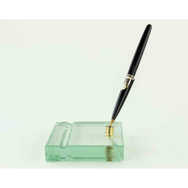 Vintage Pen holder is a decorative object realized in the 1960s. A decorative pen holder with art glass base. Good...