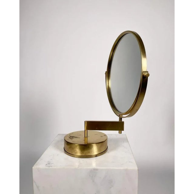 Brass vanity mirror by Hans-Agne Jakobsson, 1960s. Rotating and adjustable with one sided mirror. This piece has an...