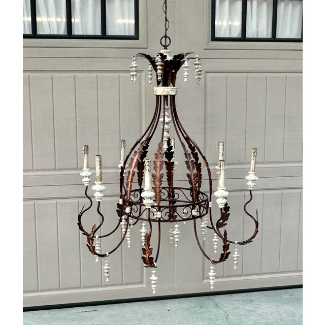 Large and spectacular, this French rustic chandelier is a perfect focal point for a dining room or tall foyer. Measuring...