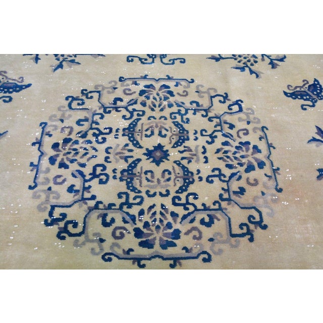 Hand-knotted with care using traditional rug-making techniques, this wool rug blends timeless craftsmanship with a modern...