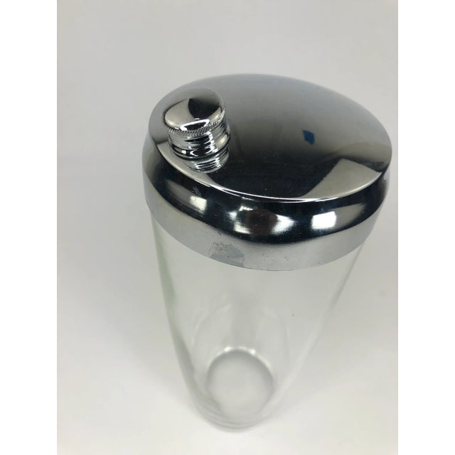 Classic Vintage Glass Cocktail Shaker with Silver Top. Shaker is 8 1/4" tall x 3 1/2" across at top and 2 1/2" across at...