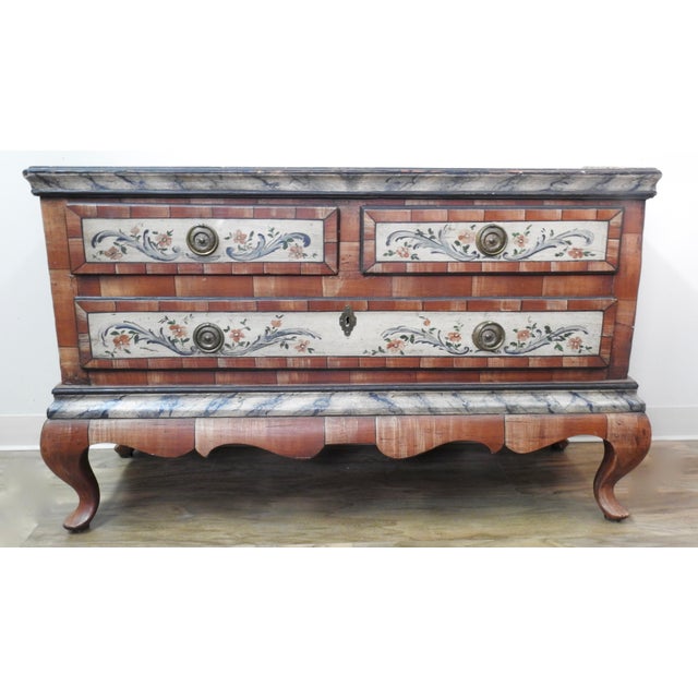 A late 18th century Scandinavian wardrobe in pine, having a restored painted finish. The upper case has a shaped top with...