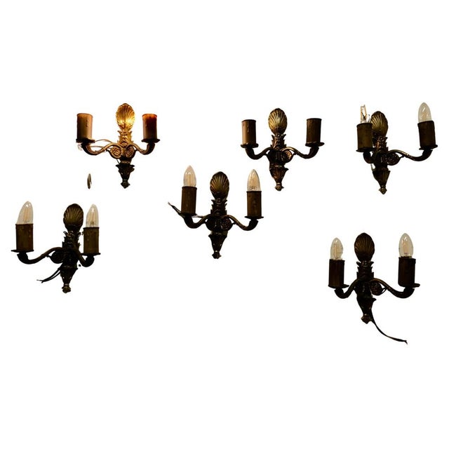 A Set of 6 Unusual Brass Twin Wall Lights This is a very attractive set of lights they each have 2 sconces and a large...