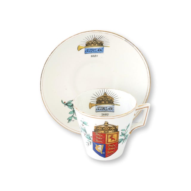 English porcelain commemorative cup and saucer celebrating Queen Victoria's Golden Jubilee of 1887. Decorated with the...