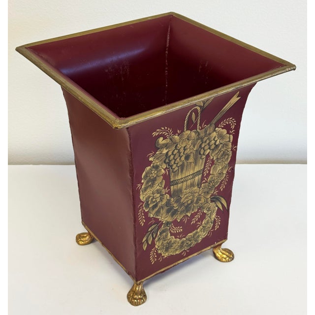 Vintage French Provincial or Neo-Classical style burgundy and gold Tole vase cachepot jardinere. Features burgundy fluted...