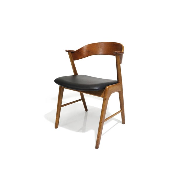 Set of four mid-century Danish dining chairs designed by Kai Kristiansen, 1955, Denmark. The chairs are handcrafted of...