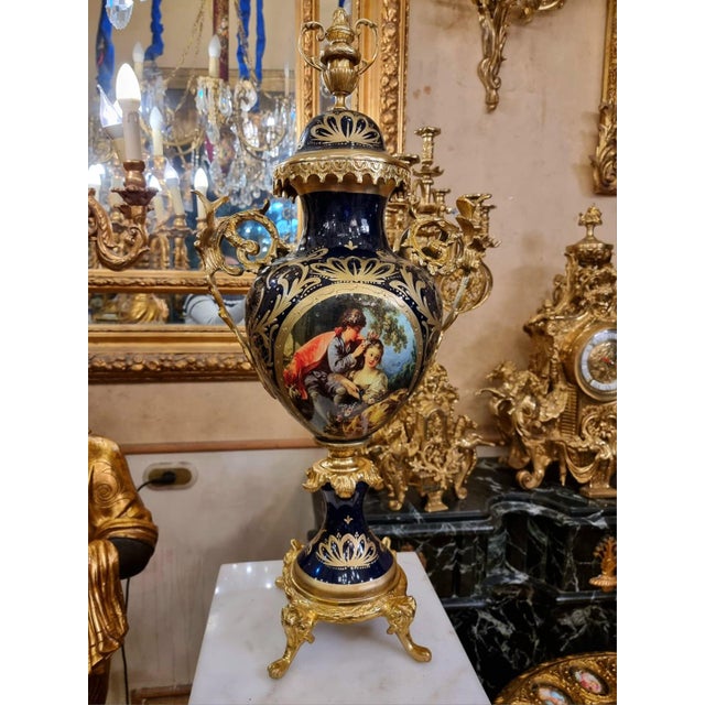 Elevate your interior with this exquisite French-style porcelain vase, a timeless decorative piece designed to bring...