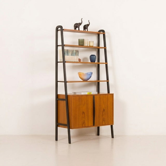 Freestanding mid-century teak shelving unit by Bräntorps, Sweden, 1960s This Scandinavian vintage freestanding shelving...