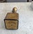 A thick gold coating with textured medallion bon two sides, front and back. The cork is wooden. Looking at top edge when...