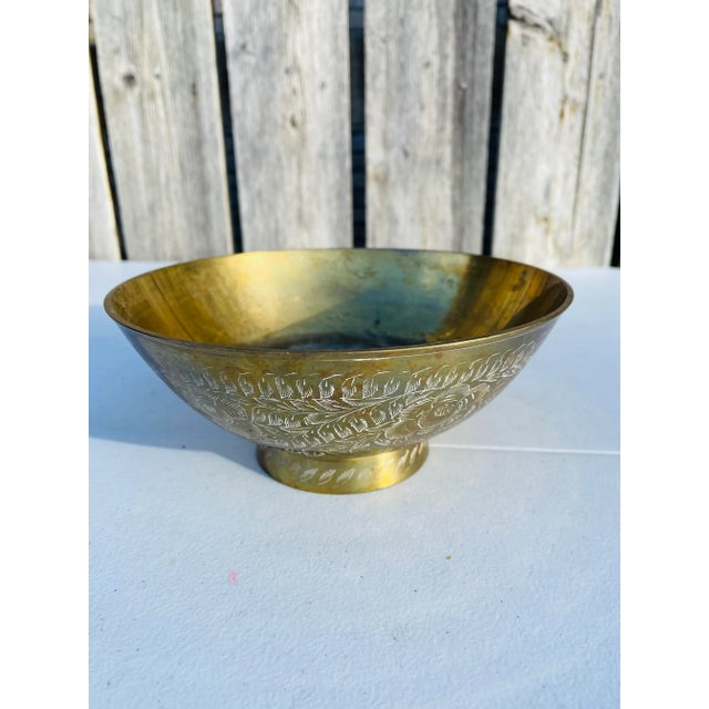 Simple vintage Asian brass bowl with engraved floral detailing. Well used with vintage patina inside. Perfect for any...