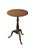 This elegant antique Queen Anne style mahogany pedestal stand features a minimalist, unadorned flat circular top with a...